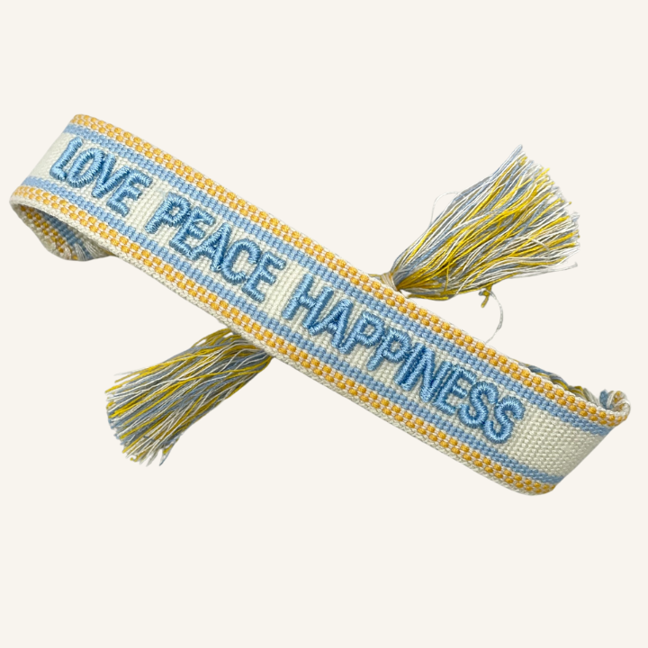 Bracciale in tessuto ricamato bianco, azzurro e arancione con scritta "LOVE PEACE HAPPINESS"