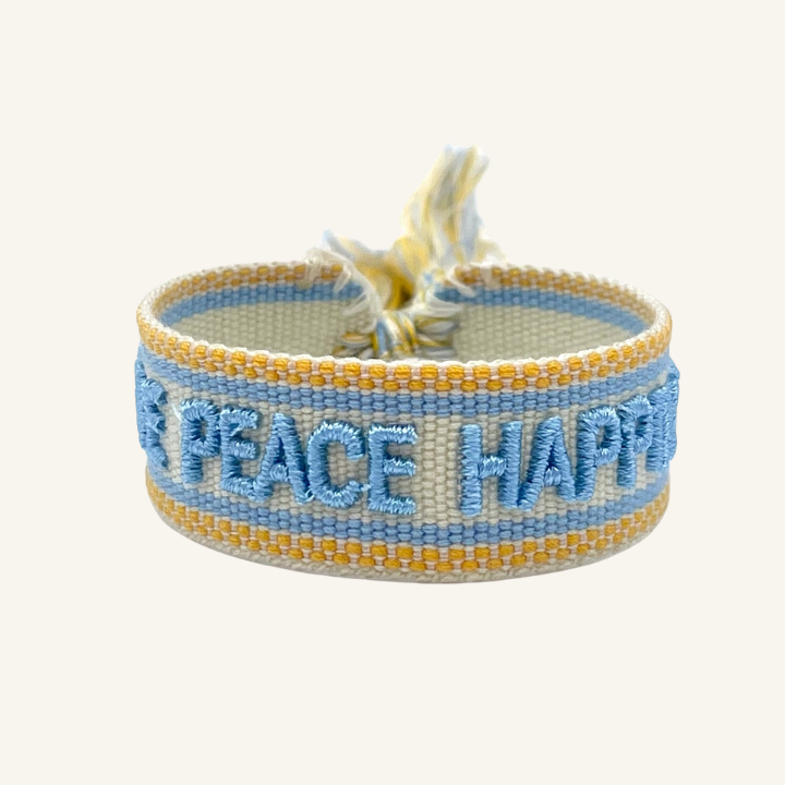 Bracciale in tessuto ricamato bianco, azzurro e arancione con scritta "LOVE PEACE HAPPINESS"