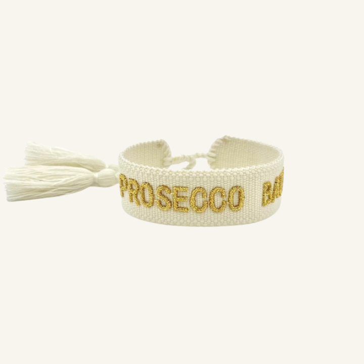 Bracciale in tessuto ricamato bianco con scritta oro "PROSECCO BABY"