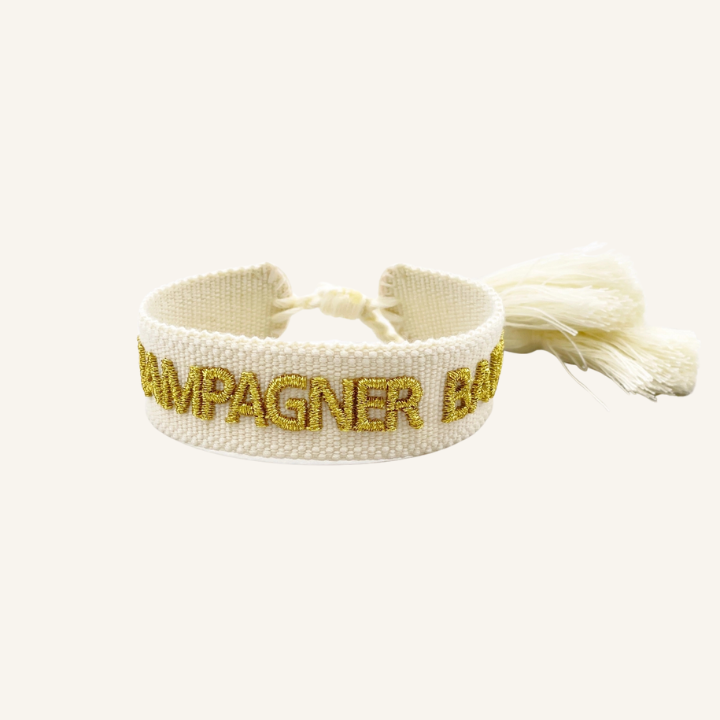 Bracciale in tessuto ricamato bianco con scritta oro "CHAMPAGNER BABY"