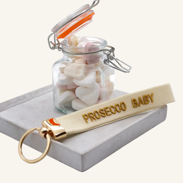 Portachiavi in tessuto intrecciato bianco con scritta ricamata oro 'PROSECCO BABY'